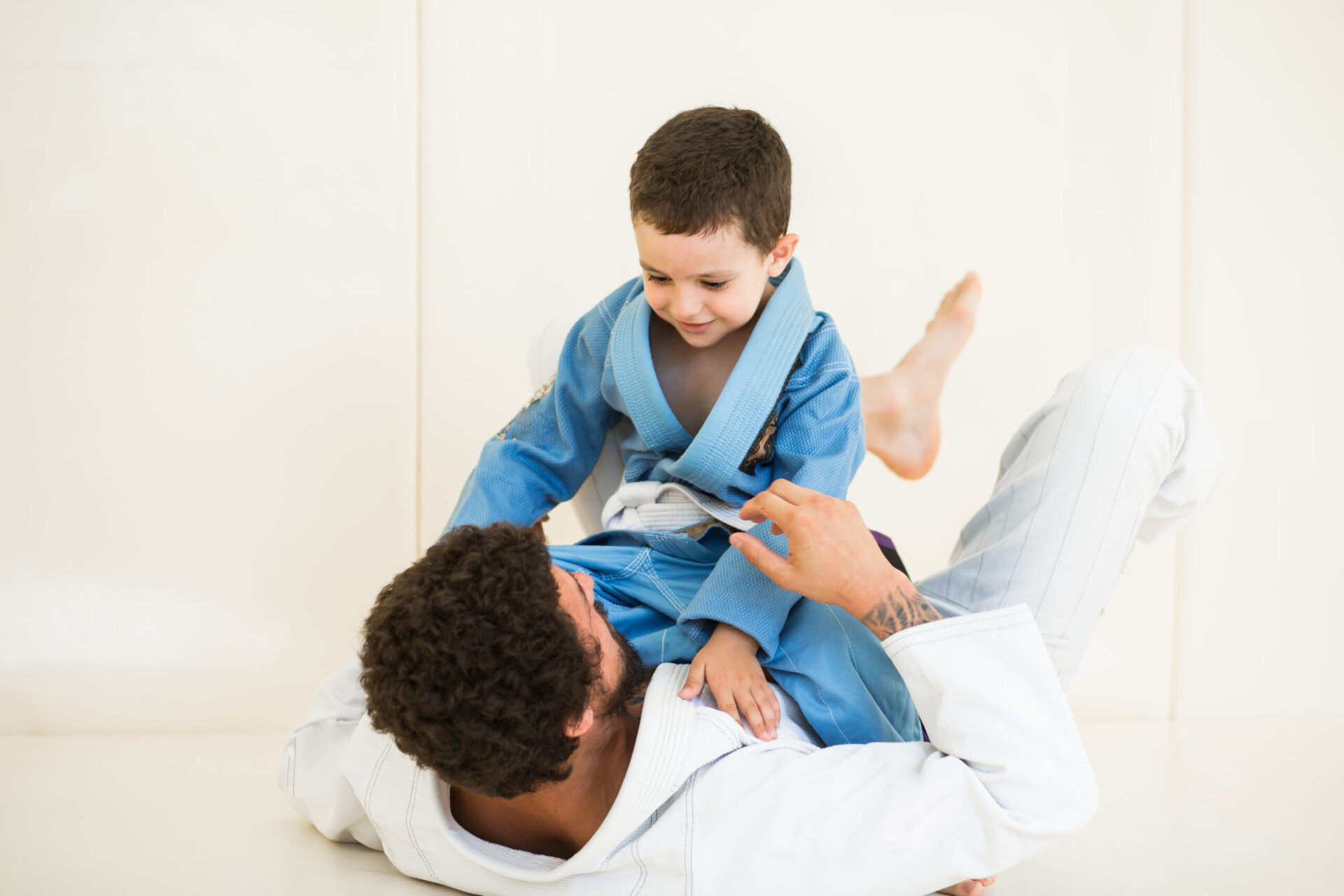 Father,And,Little,Kid,Son,Are,Engaged,In,Wrestling,Jiu-jitsu